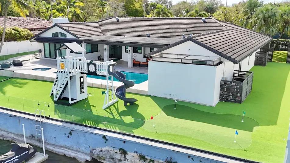 Artificial grass installation in Houston residential backyard engineered for heat and drainage